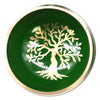 Green ceramic singing bowl set with a gold tree of life design on the bowl surface