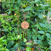 Copper-toned garden windchime with a circular wooden medallion engraved with a tree and three copper-coloured metal tubes