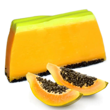 Tropical paradise soap loaf with vibrant orange and lime-green papaya layers and a dark poppy seed-studded base