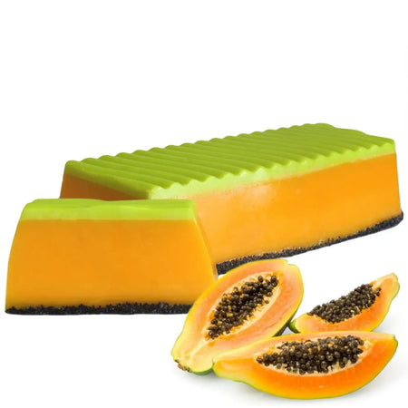 A rectangular papaya soap loaf with green top, orange middle, and dark brown base in a tropical paradise soap loaf style