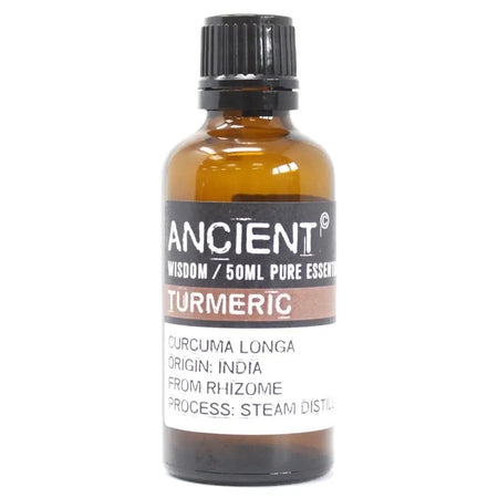 A 50ml amber glass bottle of turmeric essential oil with a black ribbed cap and label showing origin from india