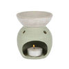 A light green ceramic oil burner with a textured whitewashed bowl and two side vents in ceramic oil style