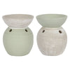 Two-tone ceramic oil burner with textured sage green and off-white ceramic oil diffusers featuring ventilation holes