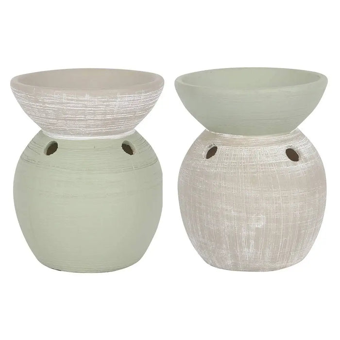 Two-tone ceramic oil burner with textured sage green and off-white ceramic oil diffusers featuring ventilation holes