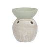 A matte white two-tone ceramic oil burner with a textured brush-stroked finish and small side vents
