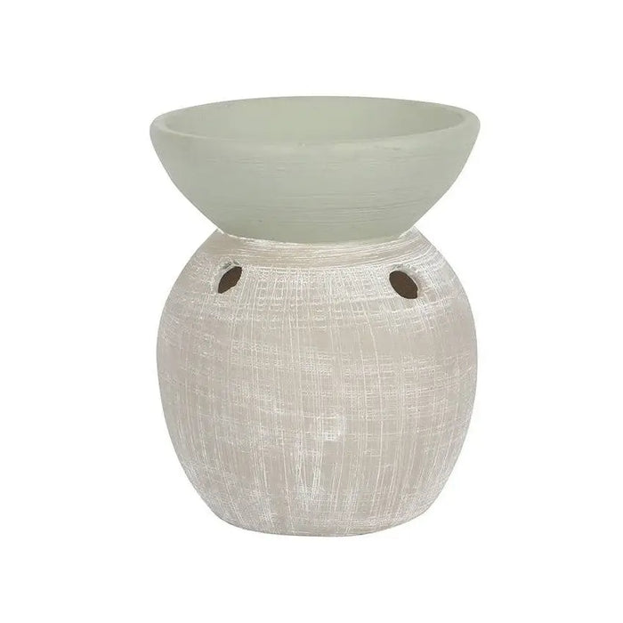 A matte white two-tone ceramic oil burner with a textured brush-stroked finish and small side vents