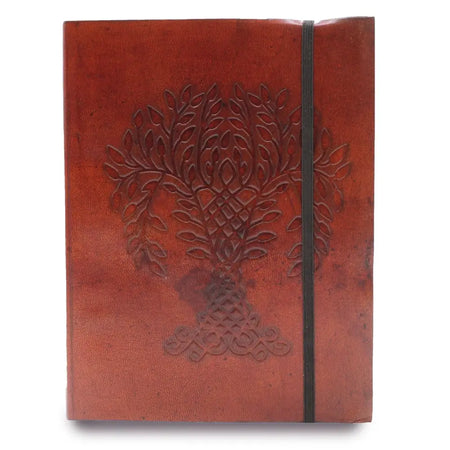 A rich brown vegetable tanned leather notebook with strap featuring an embossed tree of life and celtic knot design