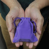 A soft purple velvet pouch with a braided drawstring cord, measuring 10x12cm for small item storage