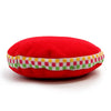 A plush red velvet singing bowl cushion shaped like a macaron with colorful checkered ribbon trim, 7cm tall