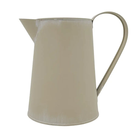 A matte cream metal jug with a curved handle and spout featuring subtle distressed edges