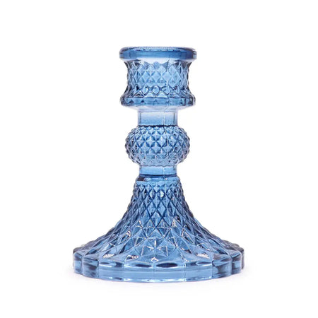 Vintage dinner candle holder in translucent royal blue glass with faceted diamond pattern and fluted base for candles