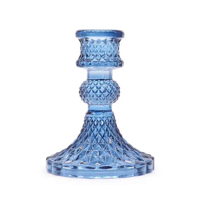 Vintage dinner candle holder in translucent royal blue glass with faceted diamond pattern and fluted base for candles