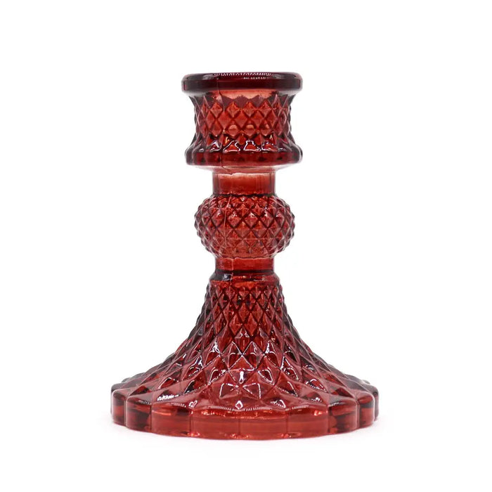 Vintage dinner candle holder in deep red faceted glass with diamond cut pattern and flared base