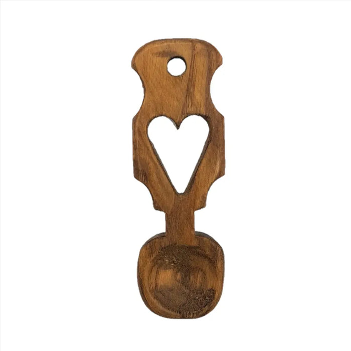 A rustic hand-crafted welsh love spoon made of wood with a heart cutout and h17cm length for decorative use