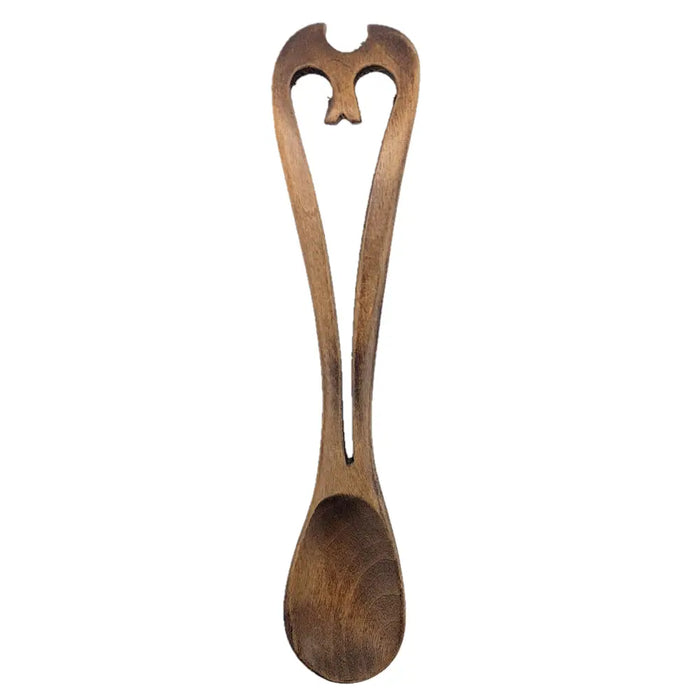 A hand carved welsh love spoon with a medium brown finish and ornate heart cutouts h17cm 5cm max spoon