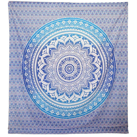 Blue and white mandala tapestry wall hanging with intricate circular patterns used as beach spread or decor