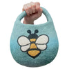 A soft blue green felted bag with an embroidered bee in black white and yellow details
