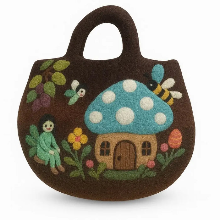 Brown felted bag with a blue polka-dotted mushroom house, bees, flowers, and a fairy in a fairy garden design