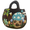 A dark brown felted bag with embroidered blue mushroom fairies bees and colorful eggs in a fairy garden theme