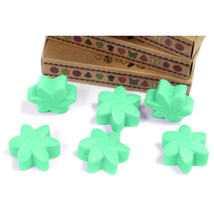 Green flower shaped wax melts made from palm waxes with a matte finish in a hidden garden box of six