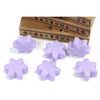 Lavender-colored flower-shaped wax melts made from palm waxes shown in a box of six for scented use