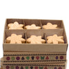 Six beige flower-shaped palm wax wax melts in a brown cardboard box with decorative patterns titled midnight jasmine box of 6