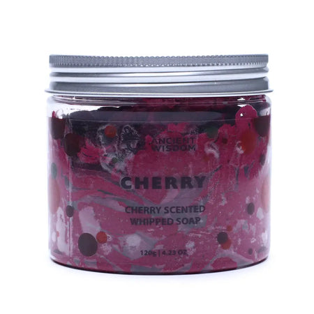 A vibrant pink and maroon cherry scented whipped soap in a clear glass jar with a silver metal lid and speckles