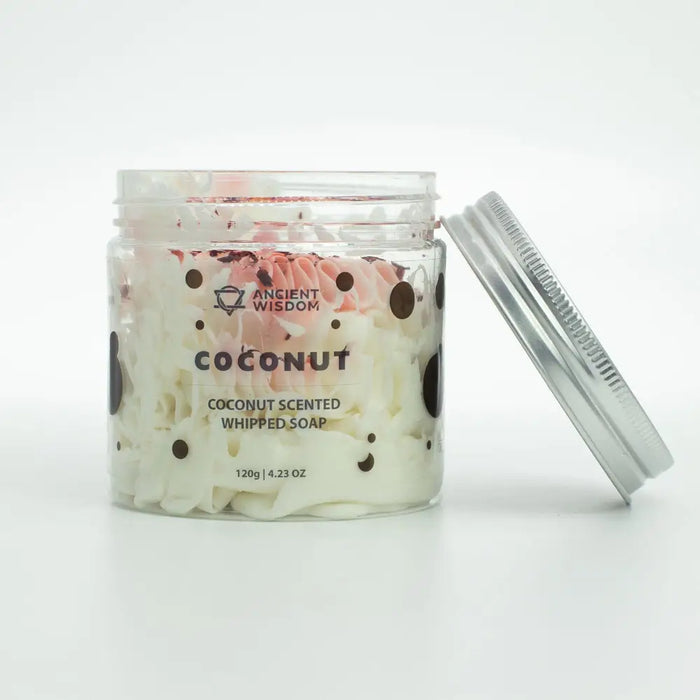 A clear glass jar with silver lid filled with white and pink coconut scented whipped soap with dark brown polka dots
