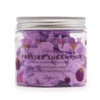 A clear glass jar with a silver lid holds purple whipped soap shaped like frosted sugar plum candy weighing 120g