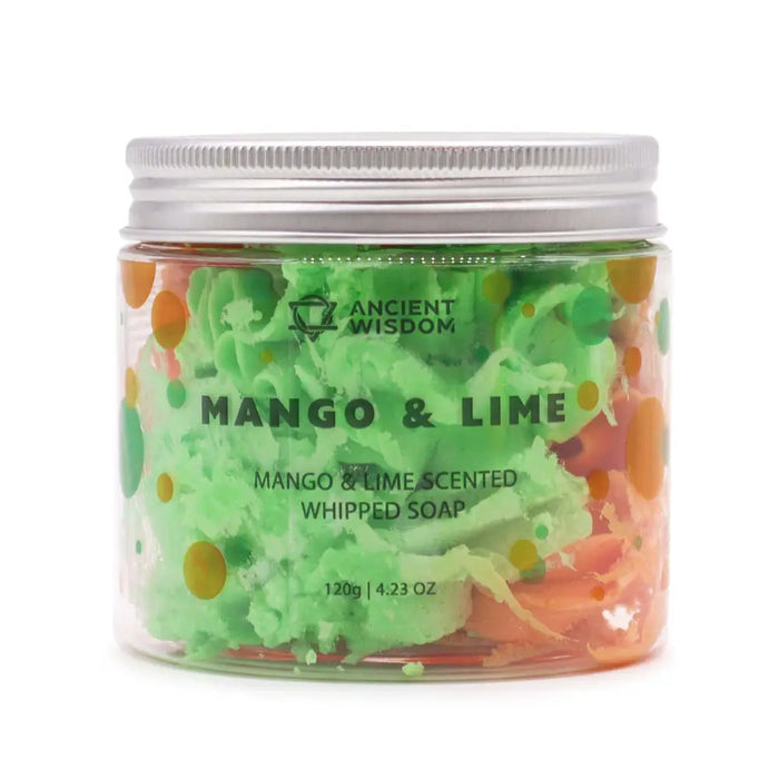 A vibrant green and orange mango and lime scented whipped soap in a clear jar with a silver lid weighing 120g