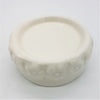 White ceramic candle stand with a glossy finish and embossed floral pattern around the rim of the candle stand