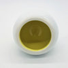 White ceramic tealight holder filled with smooth golden yellow liquid in traffic lights design with three colour options
