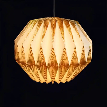 A warm geometric pendant lamp with layered paper design in cream and gold tones featuring gold glitter accents