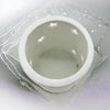 White porcelain tealight holder with star design cutouts inside available in two sizes
