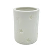 White porcelain tealight holder with star design cutouts available in two sizes for votive candles