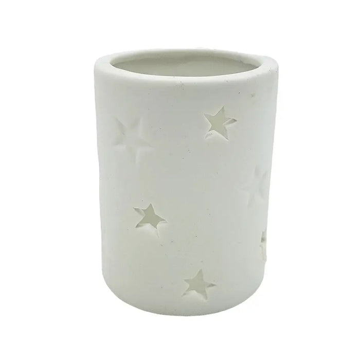 White porcelain tealight holder with star design cutouts available in two sizes for votive candles