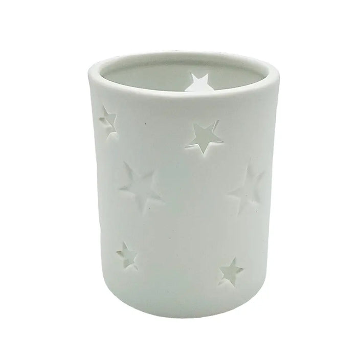 White porcelain tealight holder with star design cutouts in two sizes made of ceramic for votive candles