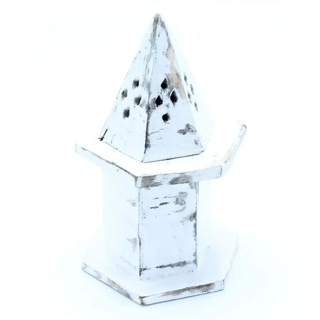White-washed mango wood incense holder with a distressed finish shaped like a mini pyramid house with cut-out holes
