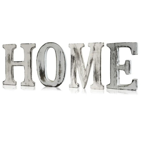 White distressed wooden letters spelling home made from rustic mango wood with a white-washed, weathered finish