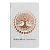 White wellness journal with textured cover and rose gold tree of life encircled by moon phases for wellness journey