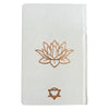 White wellness journal with 120 pages featuring a rose gold tree of life and gold lotus chakra embossing on linen cover