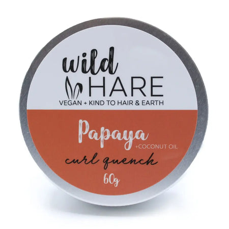 Wild hare solid shampoo curl quench with papaya and coconut oil in a silver metal round container with orange label