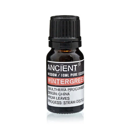 A small dark amber glass bottle with black cap labeled ancient wisdom 10ml pure wintergreen essential oil
