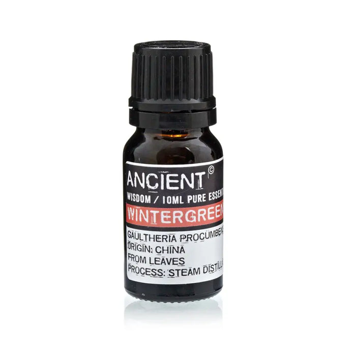 A small dark amber glass bottle with black cap labeled ancient wisdom 10ml pure wintergreen essential oil