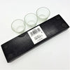 Black wooden block candle holder with three clear glass votive or tealight cups on a white background