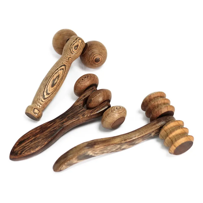 Three wooden massage rollers with natural wood grain patterns in a three disc roller design