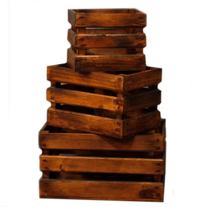 Stack of three rustic wooden storage crates in brown finish made from albesia wood with visible grain and weathered edges
