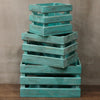 Stacked wooden storage crates in turquoise wash made from albesia wood with a rustic distressed finish