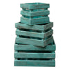 Stacked turquoise wash wooden storage crates made of albesia wood with a rustic weathered finish set of 3