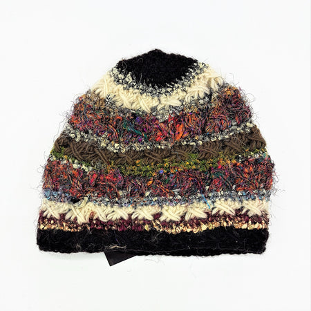 A wool and silk hand-knitted beanie hat with vibrant multicolored stripes and textured crochet details for adults